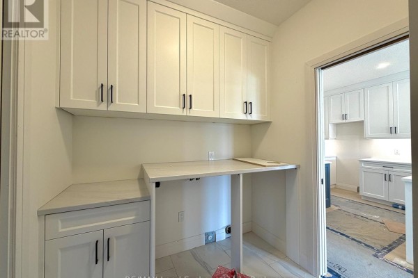 Small, unfinished room with exposed subflooring and a single window. - 383 Rosner Drive, Saugeen Shores