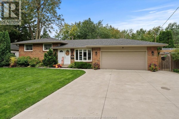 Front exterior of brick ranch home with attached garage. - 3831 Kathleen, Windsor