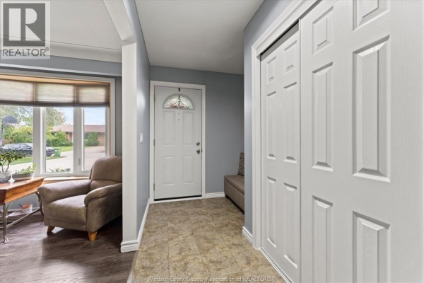 Home entryway with beige floor tiles and white paneled doors. - 3831 Kathleen, Windsor