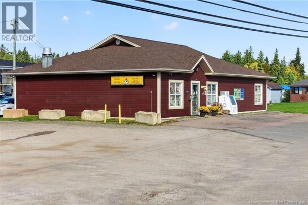 Front and side exterior view of a red commercial building with signage. - 3881 Route 134, Shediac Bridge