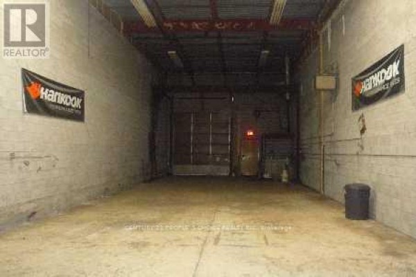 Interior of a commercial space with concrete floors, bare walls, and a large open area. - 39 - 14 Automatic Road, Brampton