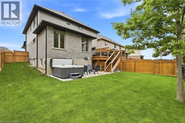 Backyard with hot tub, deck, and lawn - 39 Dunning Way St  Thomas