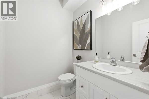 Bathroom with vanity, sink, mirror, and toilet - 39 Dunning Way St  Thomas