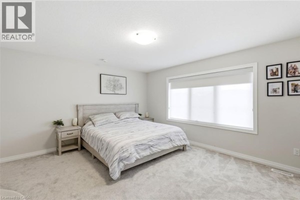 Bedroom with queen bed, nightstand, artwork, and large window - 39 Dunning Way St Thomas
