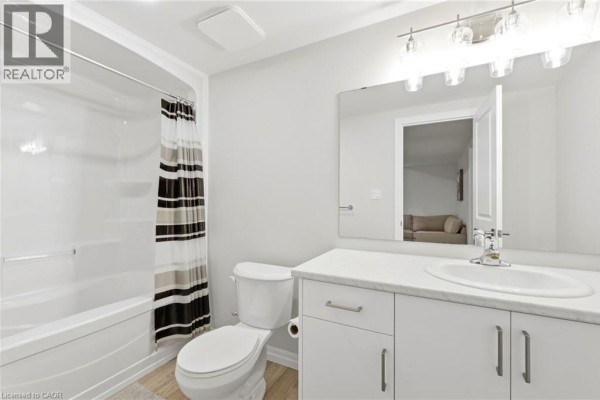 Modern bathroom with vanity, sink, tub, and mirror - 39 Dunning Way St  Thomas