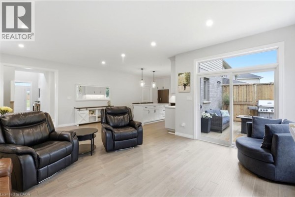 Living room with leather recliners, island kitchen, and patio access - 39 Dunning Way St  Thomas