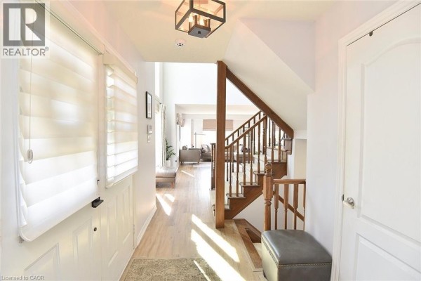 Home gym with a rowing machine, stationary bike, and a weight bench. - 39 Panabaker Drive Unit# 7, Ancaster