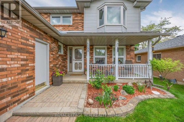 Spacious backyard with a deck, gazebo, and well-maintained lawn - 39 Passmore Avenue, Orangeville