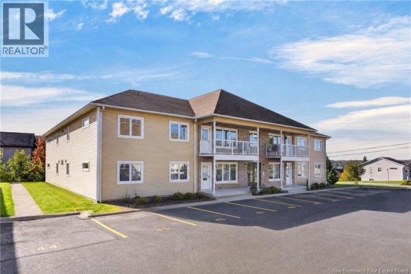 Side view of the apartment building showing its modern design with multiple windows and balconies. - 39 Sunny Brae Drive Unit# 214, Fredericton