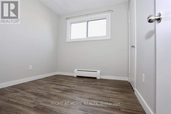 Another view of small bedroom with window and heating unit - 394 Thiel Street, London East