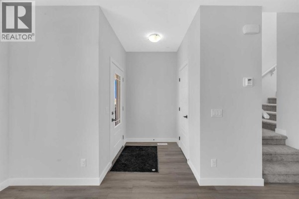 Living room - 399 Hotchkiss Manor Se, Calgary, AB T3S0M9 Photo 2