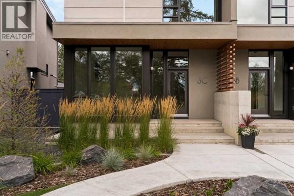 Entrance to 3c Willow Crescent SW with steps and planters. - 3c Willow Crescent Sw, Calgary