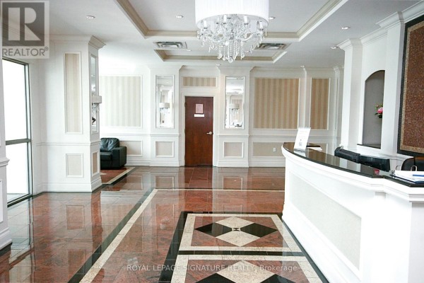 Fitness room with treadmills, elliptical machines, and a television. - 3m - 8 Rosebank Drive, Toronto