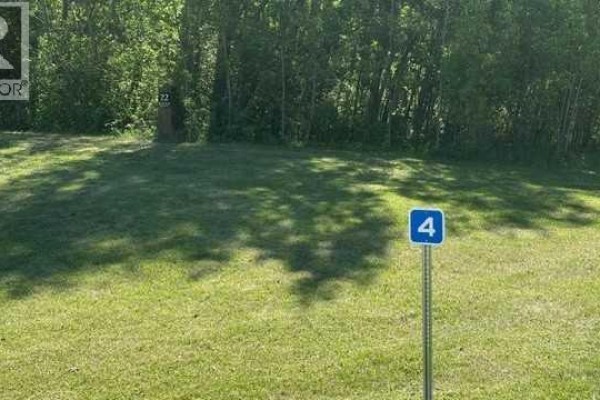 A metal gate with wooden posts displays a sign reading "THE PROPERTIES OF EAGLES QUAY". - 4, 2404 394 Township, Rural Lacombe County