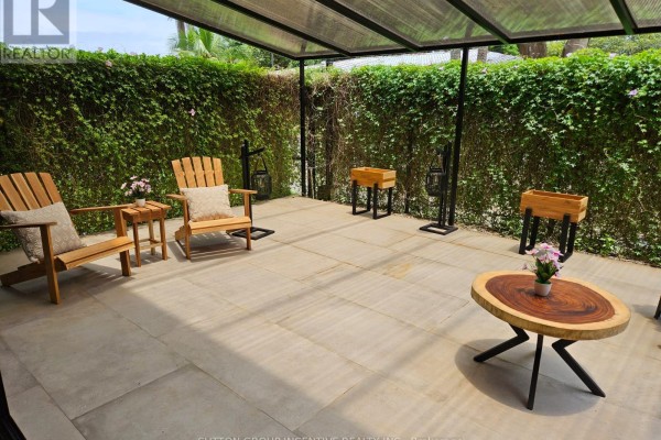 Outdoor patio with two wooden Adirondack chairs, a small wood table, and planters under a covered roof. - #4 - 1 Azul Court, Costa Rica