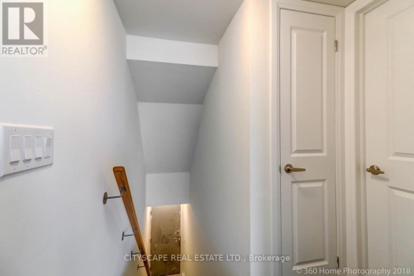 Empty bedroom with light cream walls and a large white sliding door closet. - 4 - 142 William Duncan Road, Toronto