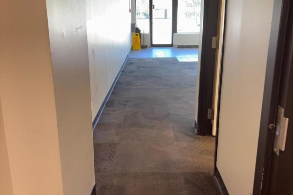 Interior view of a garage with a concrete floor and overhead door. - 4 - 669 10th Street W, Owen Sound