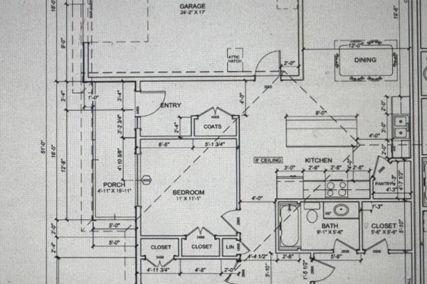 Floor plan for a home with labeled rooms: bedroom, bath, kitchen, dining, porch, and garage. - 4 Beech Hill Drive, East Royalty