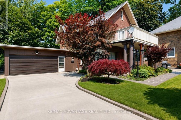 Close-up of the brown detached garage with a metal door and a small side entrance. - 4 Farley Place, St  Thomas
