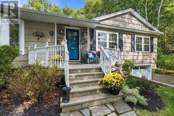 Close-up of the front porch stairs and bright blue front door with stone accents on the house. - 4 Fleming Drive, Halifax
