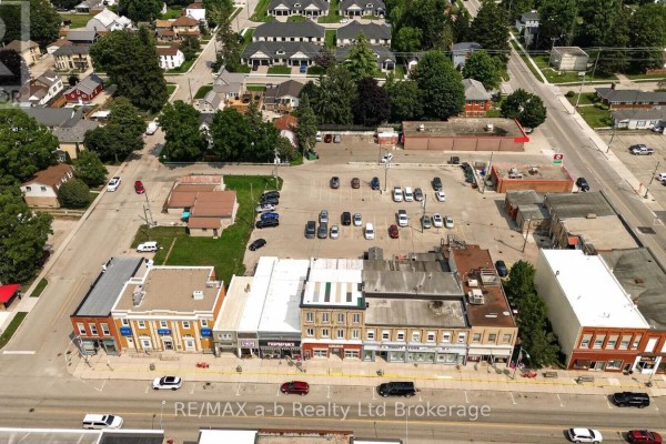 Aerial panorama of the street showing the commercial building, surrounding businesses, and residential areas. - 4 Washington Street, Norwich