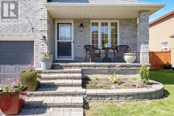 Close-up of the front porch entrance with two chairs, a small table, and potted plants. - 4 Whispering Pine Place, Barrie
