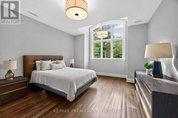 Bedroom with king bed and arched window - 40 Golf Avenue Vaughan