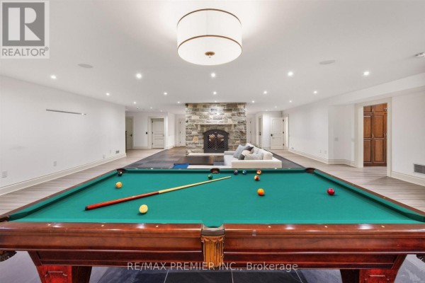 Pool table and fireplace in finished basement - 40 Golf Avenue Vaughan
