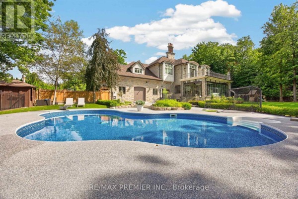 Luxury backyard with pool, trampoline, and stone house - 40 Golf Avenue Vaughan