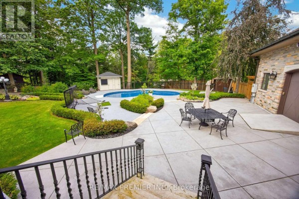 In-ground pool and patio with outdoor dining set - 40 Golf Avenue Vaughan