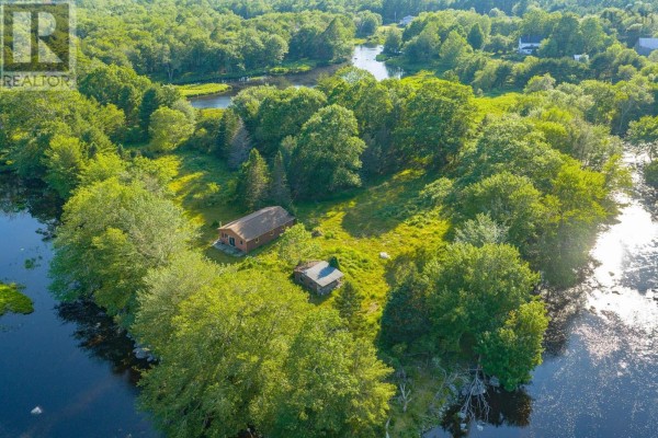Aerial view of cabin on island-like property surrounded by water and lush green trees. - 40 Mcgillis Island, Middle Ohio