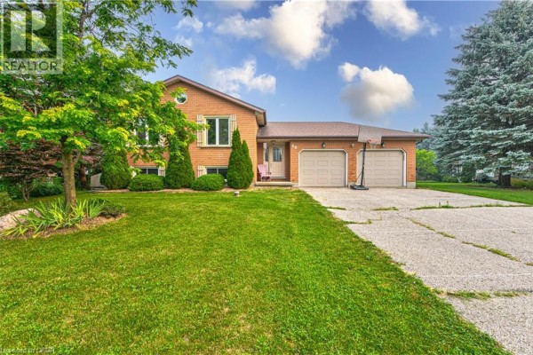 Front view of a two-story brick house with a concrete driveway. - 40 Peter Street, Scotland