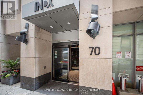Entrance to the INDX building at 70 Temperance Street with modern sculpture details. - 4006 - 70 Temperance Street, Toronto