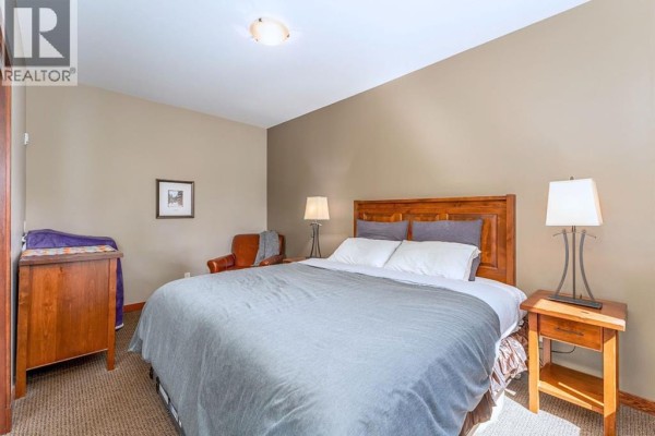 Primary Bedroom - 401, 190 Kananaskis Way, Canmore, AB T1W3E9 Photo 4