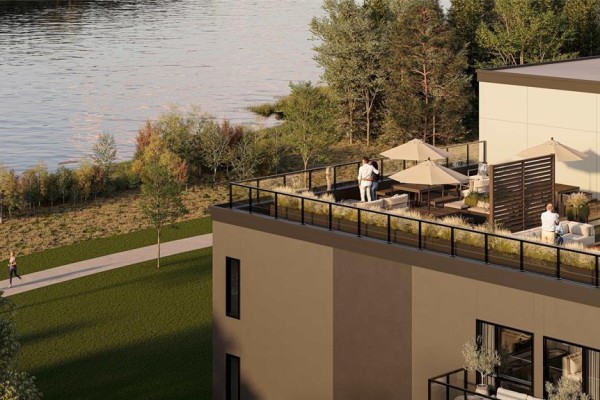 Rooftop patio with seating areas and umbrellas overlooking a river and parkland. - 401 2328 St. Mary's Road, Winnipeg