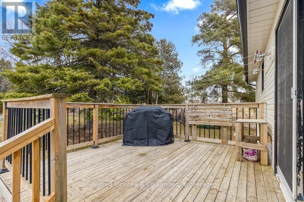 Wooden deck with covered grill and bench - 401395 Grey Rd 4 West Grey