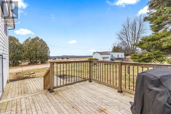 Wooden deck with railing and grill cover - 401395 Grey Rd 4 West Grey