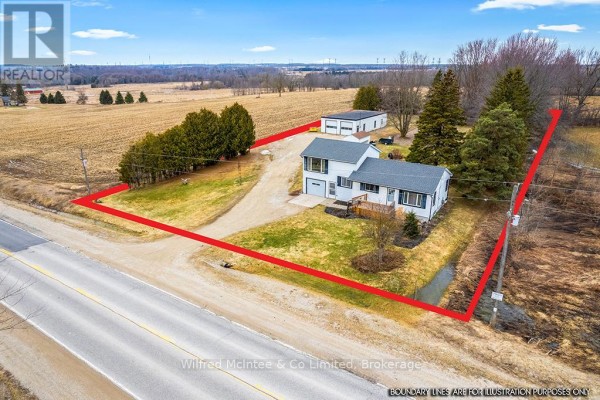 Aerial view of house with attached garage and outbuilding on rural property - 401395 Grey Rd 4 West Grey