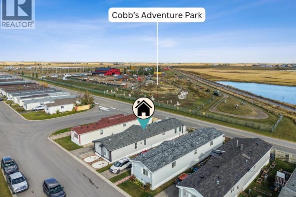 Aerial view showing the property's location relative to Cobb's Adventure Park. - 402, 1101 84 Street Ne, Calgary