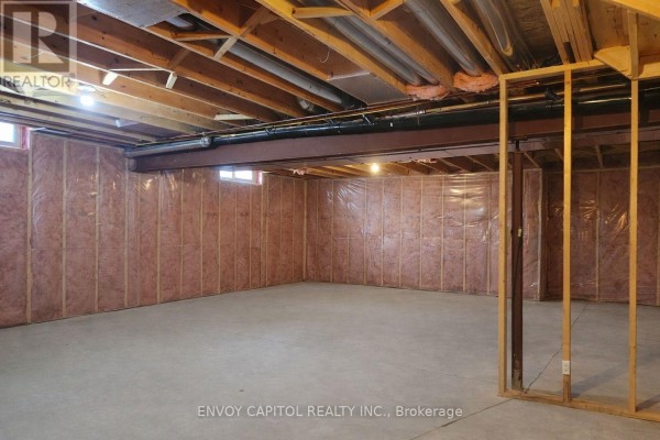 Unfinished basement with insulation, exposed joists, concrete floor - 402 Palamino Place, Waterloo