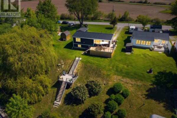Aerial view of property with main house, guest house, and dock stairs. - 402 South Coast Drive, Haldimand