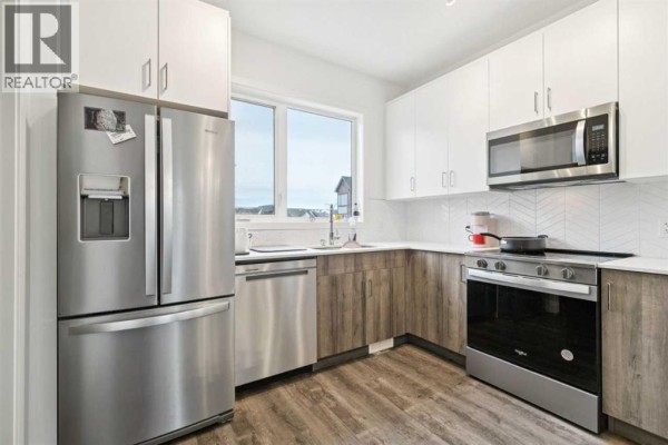 Kitchen - 403, 850 Belmont Drive Sw, Calgary, AB T2X4A6 Photo 3