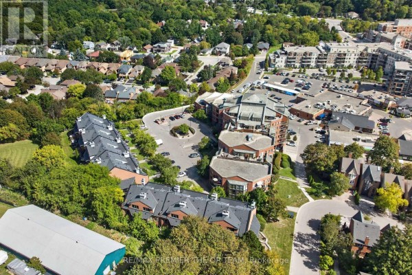 Aerial view of apartment buildings and surrounding residential neighborhood. - 404 - 100 Arbors Lane, Vaughan
