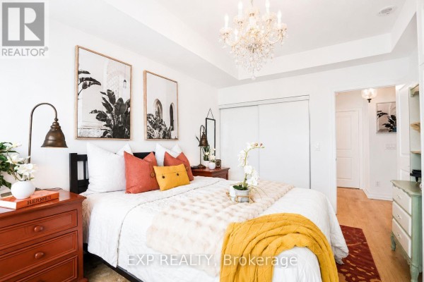 Bathroom with double vanity, white countertop, mirror, and decorative shelving. - 404 - 500 St Clair Avenue W, Toronto