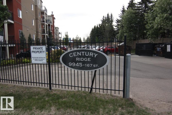 Metal fence with "Century Ridge 9945-167 St" sign and private property warning. - #404 9945 167 St Nw, Edmonton