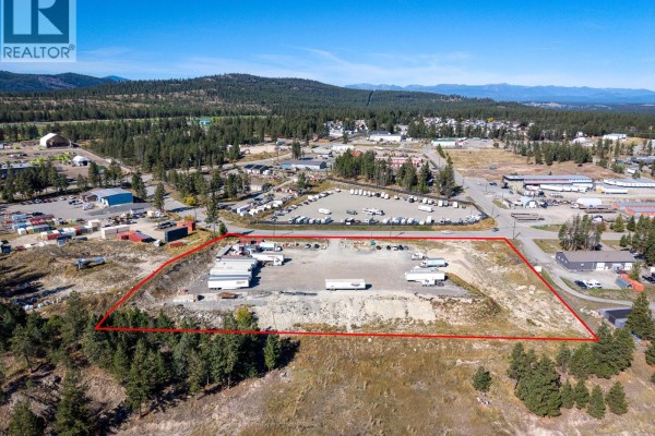 View from above of an industrial lot featuring multiple semi-trailers and storage units. - 405 Industrial F Road, Cranbrook