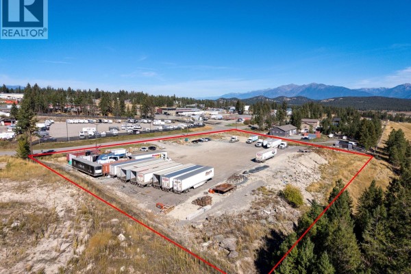 Close-up aerial perspective of an industrial lot with semi-trailers and gravel surface. - 405 Industrial F Road, Cranbrook