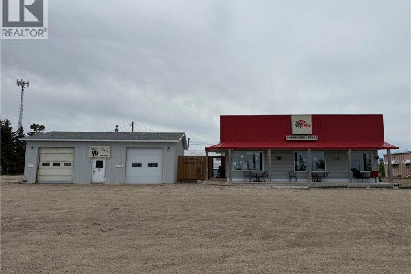 Exterior view of a commercial building with a car wash and a convenience store. - 406 - 410 Railway Avenue, Eston