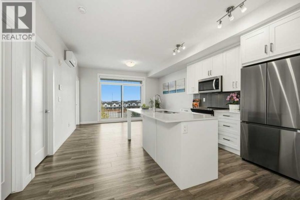 Living room - 407, 500 Auburn Meadows Common Se, Calgary, AB T3M3P5 Photo 2