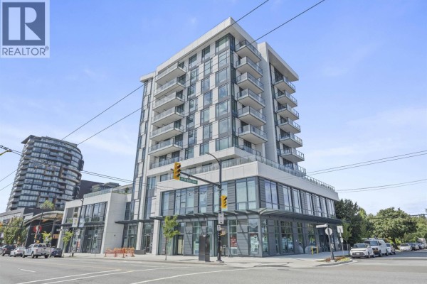 Exterior view of a modern, multi-story apartment building with glass balconies and retail space. - 407 8415 Granville Street, Vancouver
